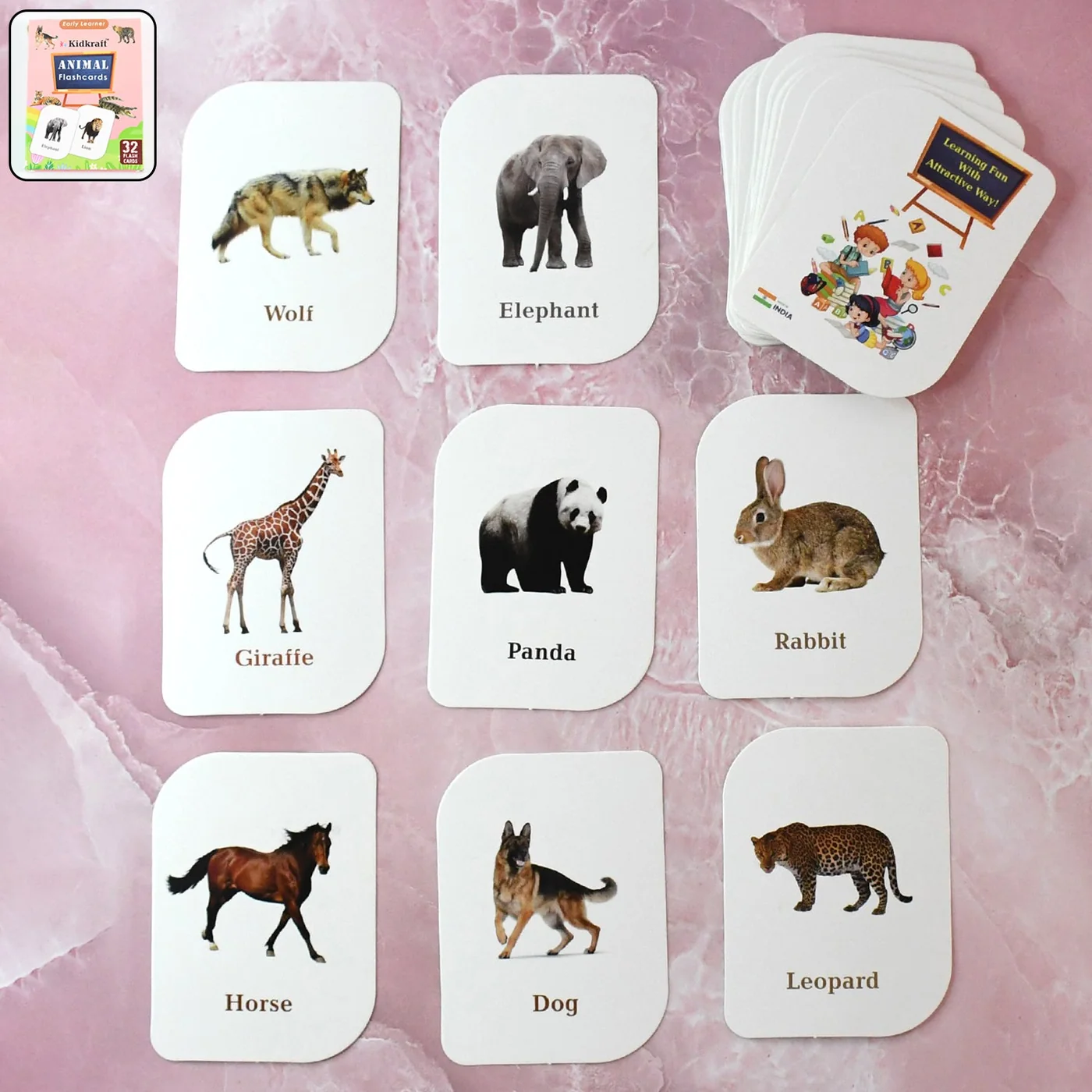 Animal flash cards laid out showing wolf, elephant, giraffe and more