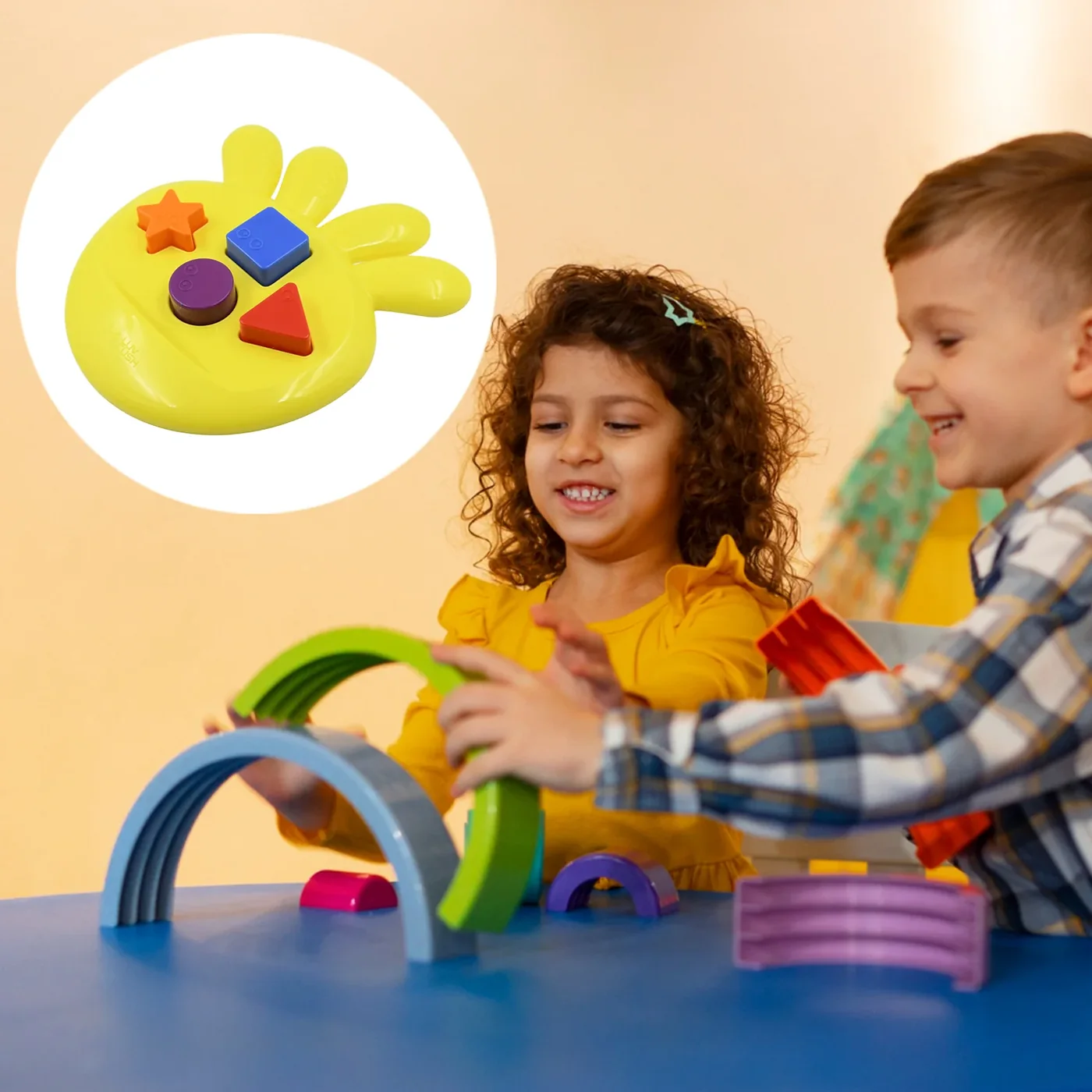 Two children playing with shape toys at a table