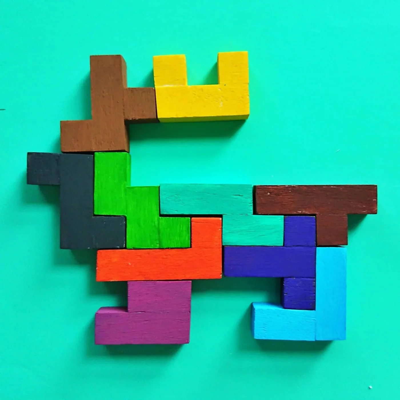 Wooden Mind Game blocks arranged in a colourful pattern